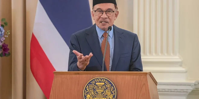 Laporan Polisi Mahathir vs Anwar soal Kesepakatan Dagang AS